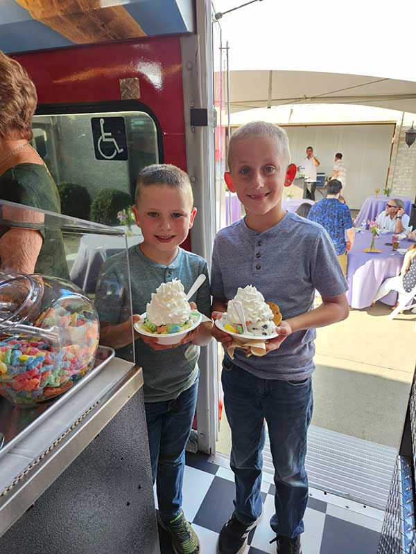 Kids Holding Their Ice Cream on the Bus