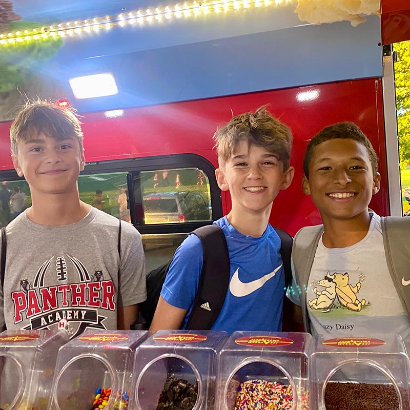 Kids Getting Served Ice Cream on the ICE Bus