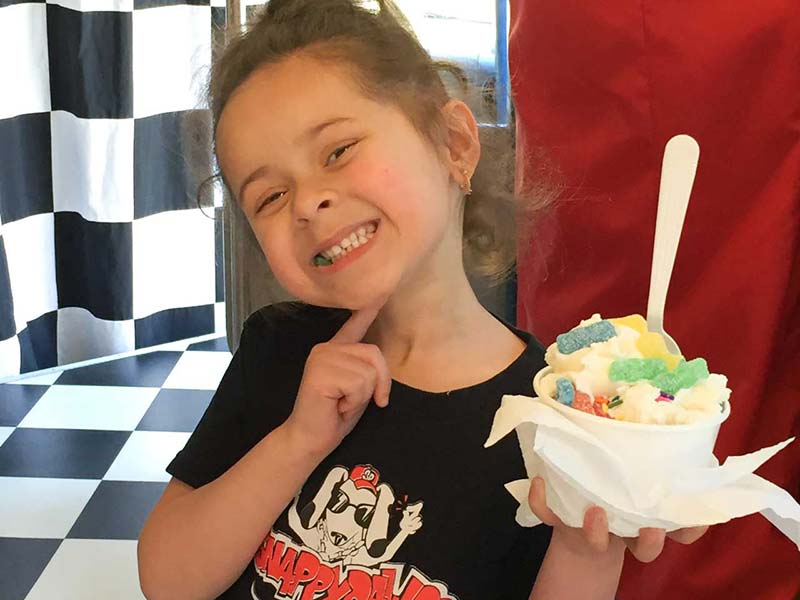 Young Girl with Her Ice Cream and Gummie Bears Young Girl with Her Ice Cream and Gummie Bears