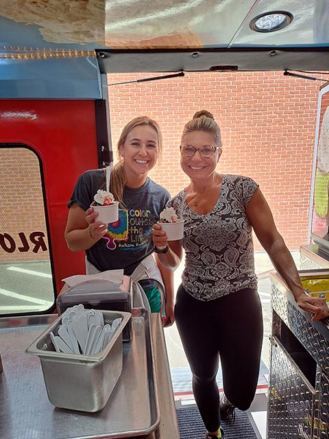 Two Women Holding Ice Cream at a Southern Rhode Island Event Two Women Holding Ice Cream at a Southern Rhode Island Event