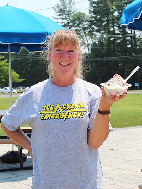 Woman Holding Up Her Ice Cream Treat in Southern RI Woman Holding Up Her Ice Cream Treat in Southern RI