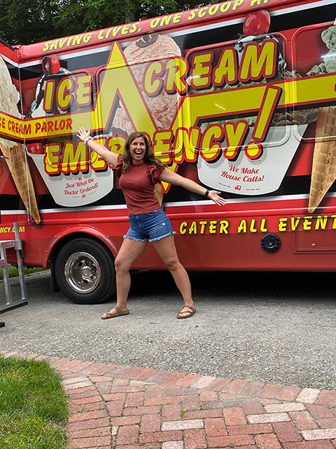 southern-rhode-island-ice-cream-excitement Woman Standing in Front of the Ice Cream Emergency Bus in RI